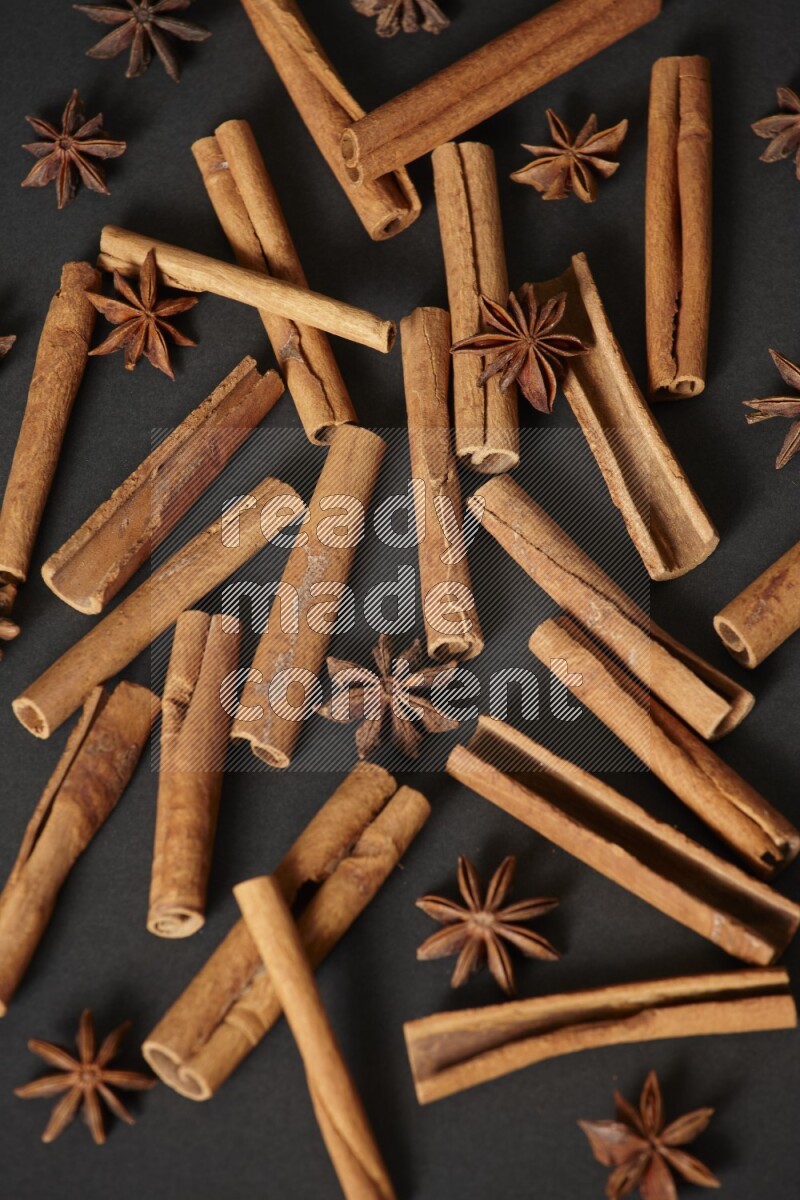 Cinnamon sticks and star anise on black background