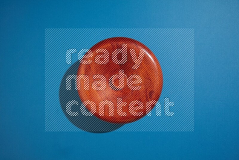 brown bowl on blue background