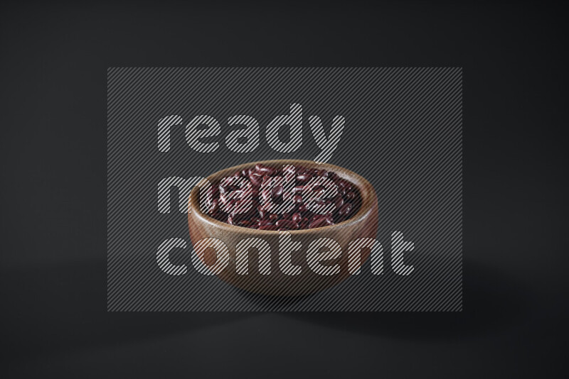Red kidney beans in a wooden bowl on grey background
