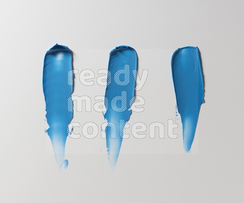 Blue painting knife strokes on white background