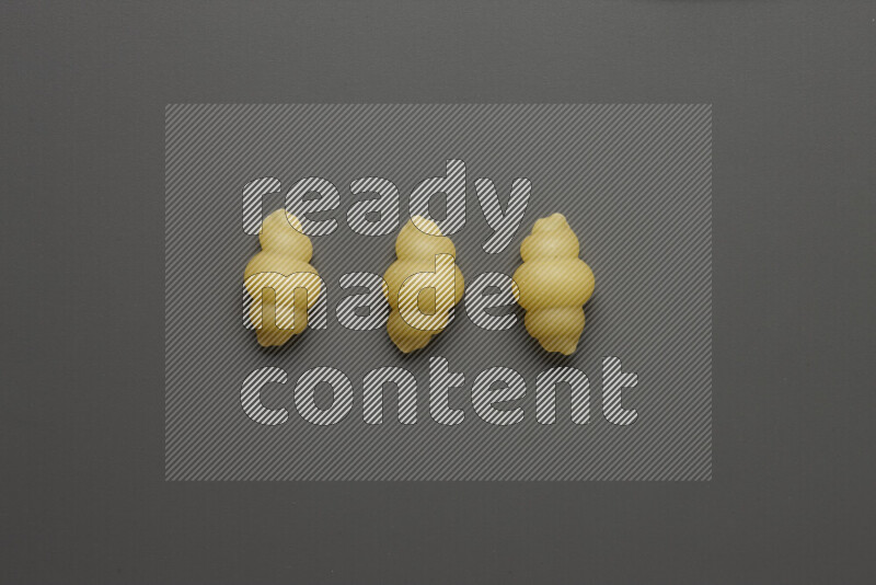 Snails pasta on grey background