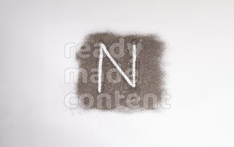 Alphabets written with glitter on white background