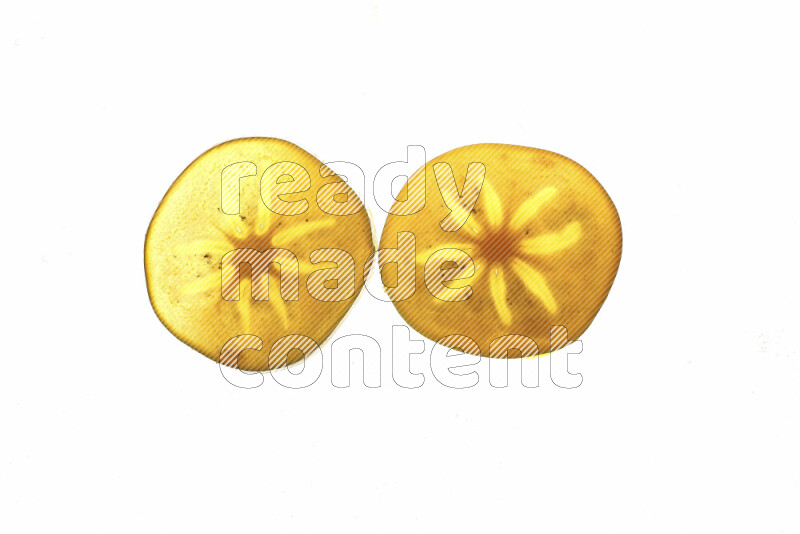 Persimmon slices on illuminated white background