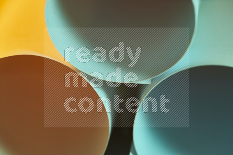 The image shows an abstract paper art with circular shapes in varying shades of green and warm tones