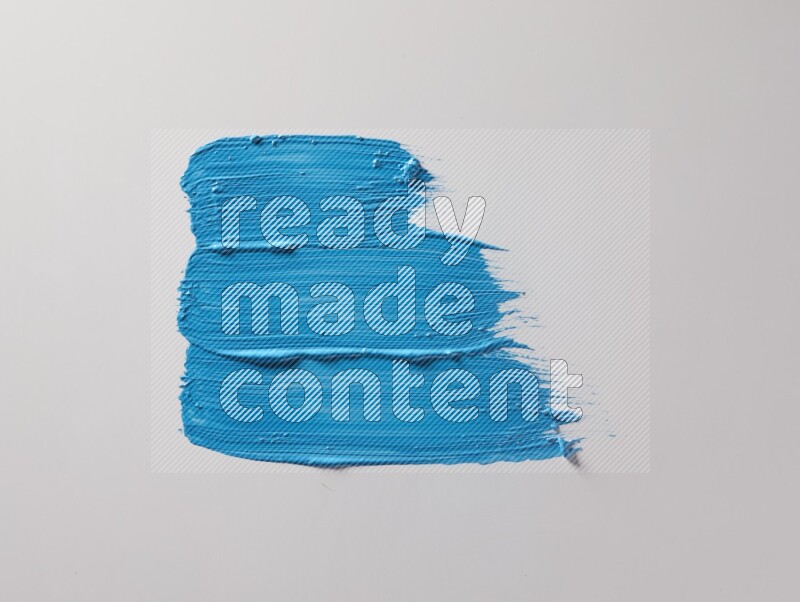 Multi blue straight brush strokes in different shapes on a white background