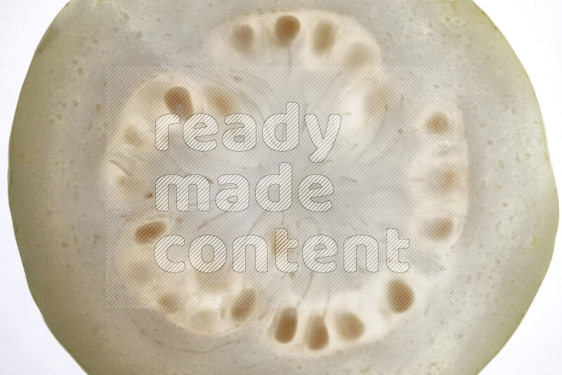 Guava slices on illuminated white background