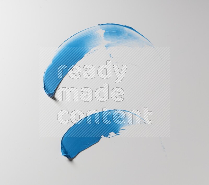 Blue curved painting knife strokes on white background
