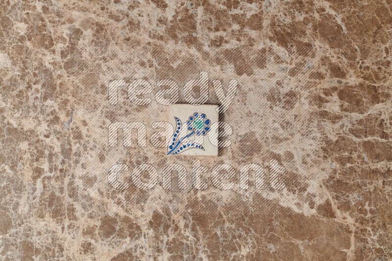 A decorative coaster on beige marble background