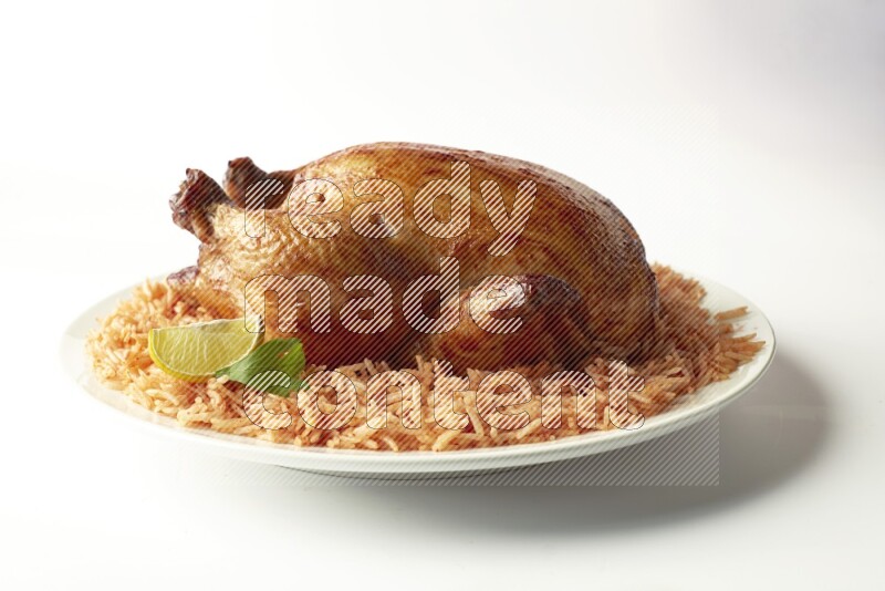 red basmati Rice with  whole roasted chicken on a white rounded plate  direct  on white background