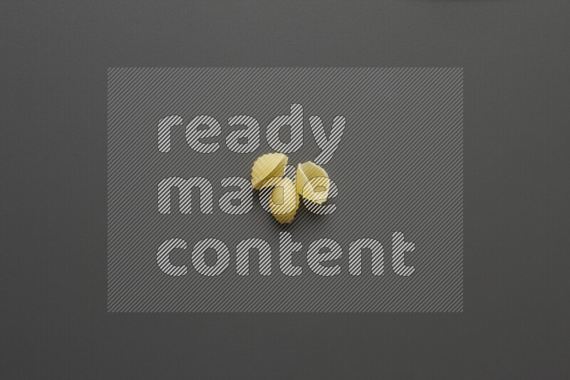 Shells pasta on grey background
