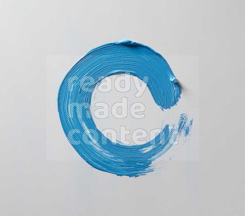A single blue curved brush stroke on a white background