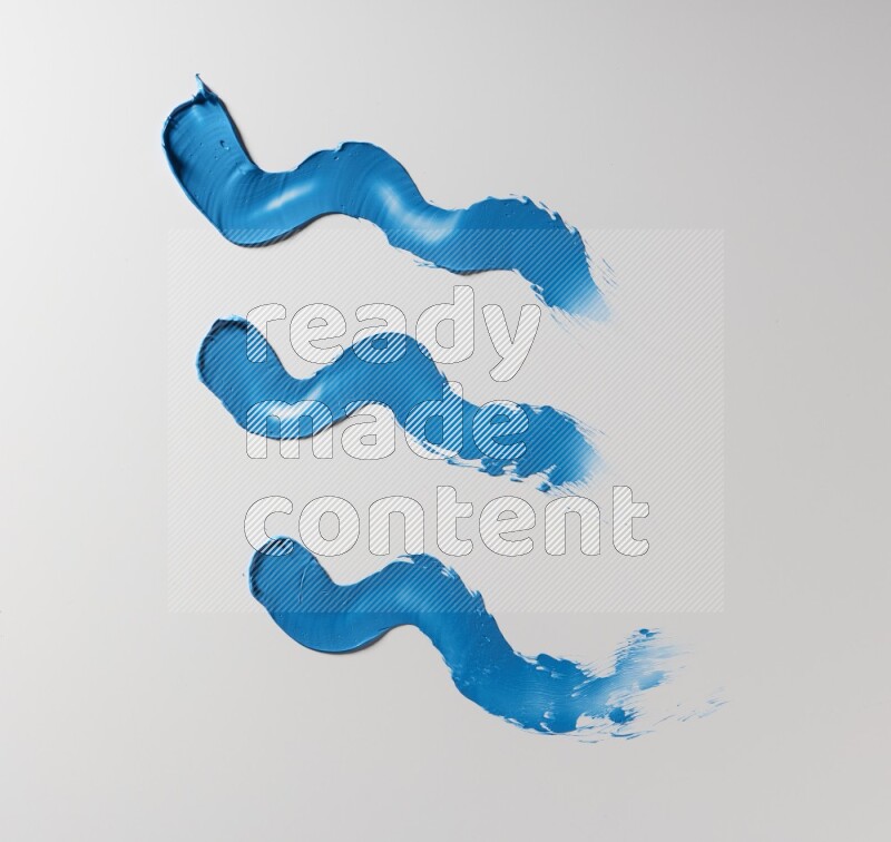 Blue zigzag painting knife strokes on white background