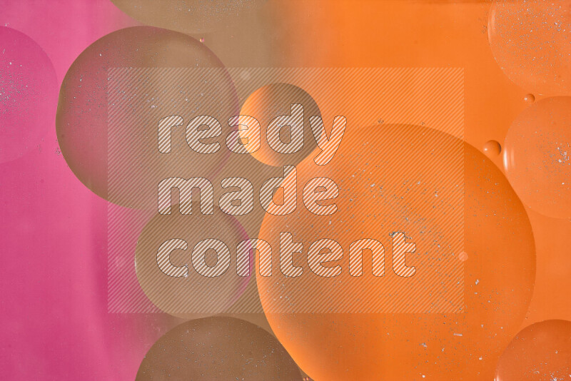 Close-ups of abstract oil bubbles on water surface in shades of brown, orange and pink