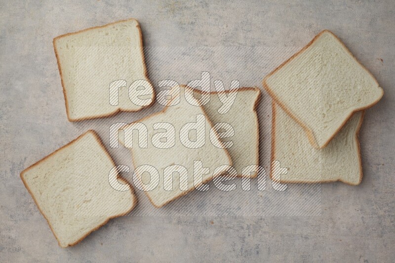 White Toast slices on alight blue textured background
