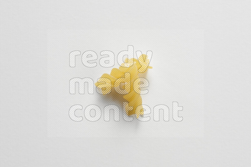 Fusilli pasta on white background