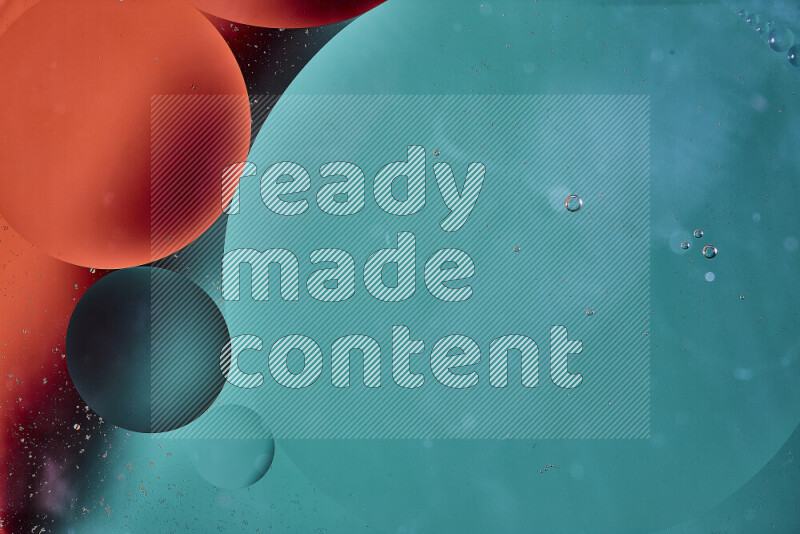 Close-ups of abstract oil bubbles on water surface in shades of green and orange