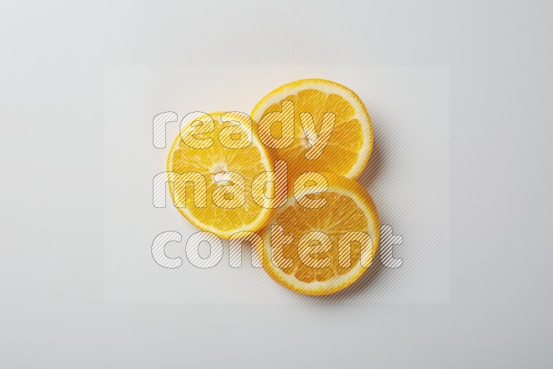 Three orange slices on a white background