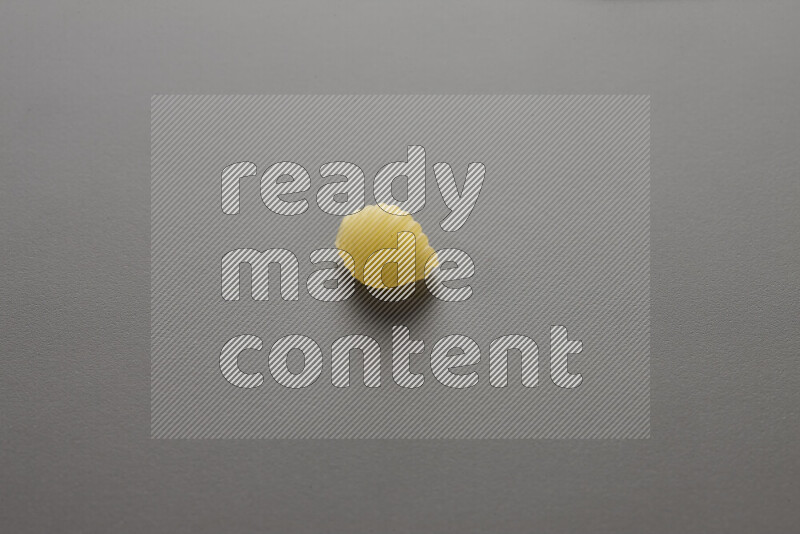 Shells pasta on grey background