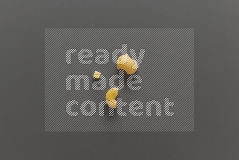 Different pasta types on grey background