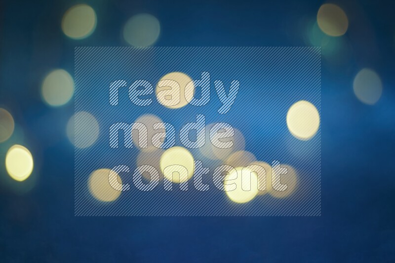 Bokeh light in yellow with blue background