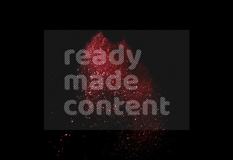 Red glitter powder isolated on black background