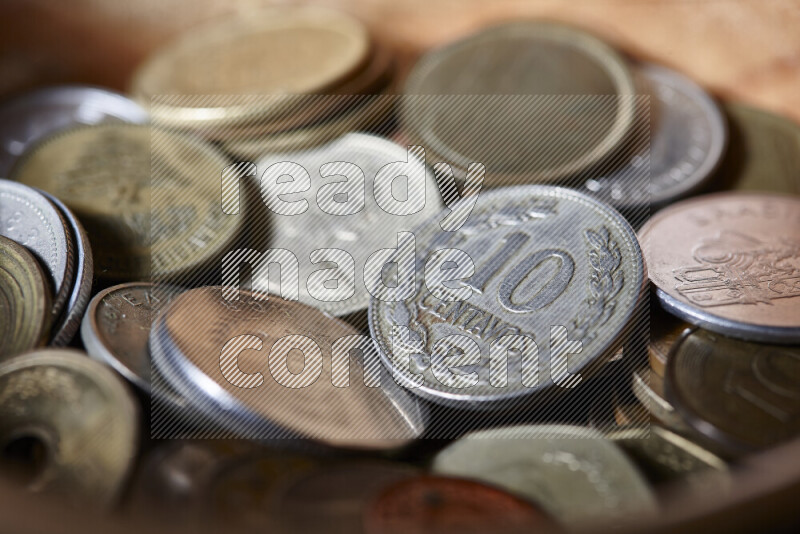 A close-ups of random old coins on black background