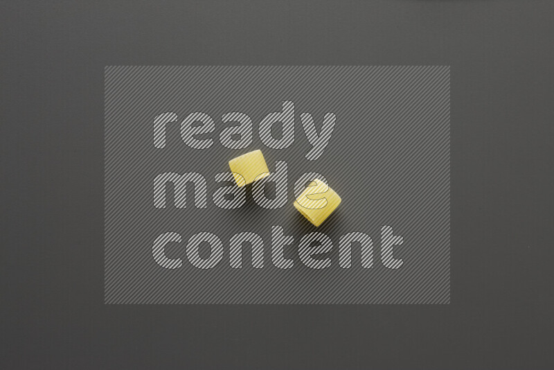 Big rings pasta on grey background