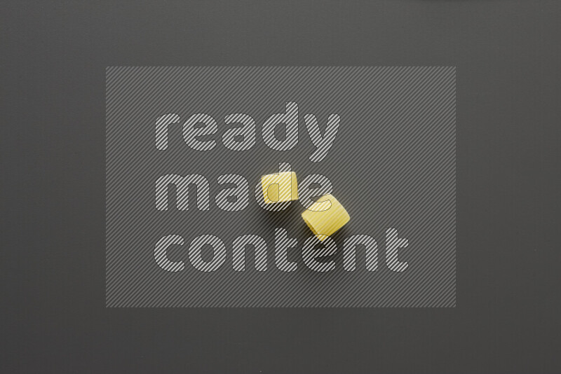 Big rings pasta on grey background