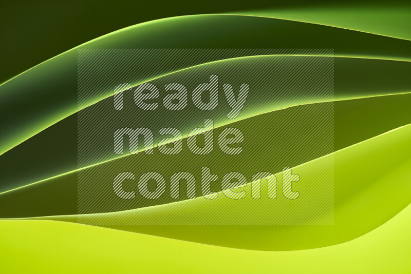 This image showcases an abstract paper art composition with paper curves in green gradients created by colored light