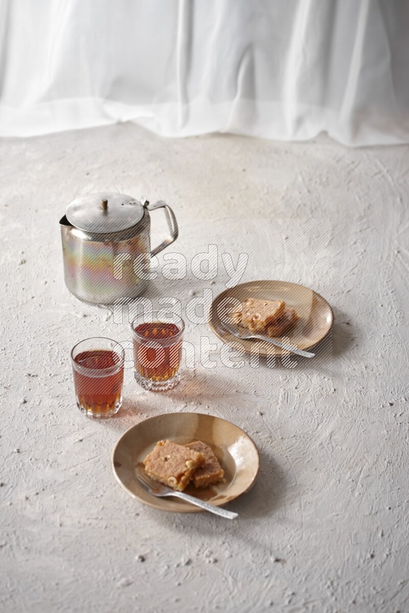 Basbousa with tea in a light setup