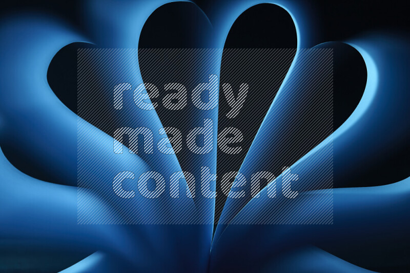 فن تجريدي يعرض منحنيات وتدرجات اللون الأزرق مكونه بضوء ملون