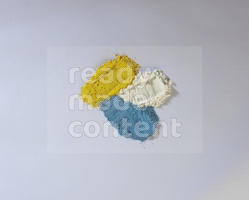 Multicolored powder smears on white background