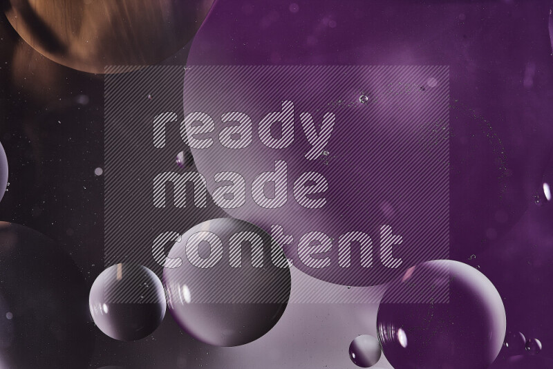Close-ups of abstract oil bubbles on water surface in shades of purple