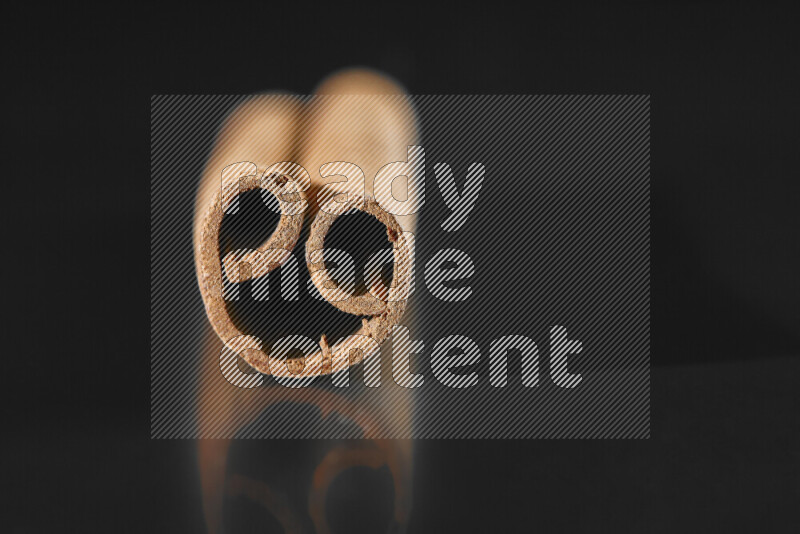 Cinnamon sticks on black background