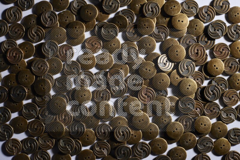 Metal buttons placed on grey background