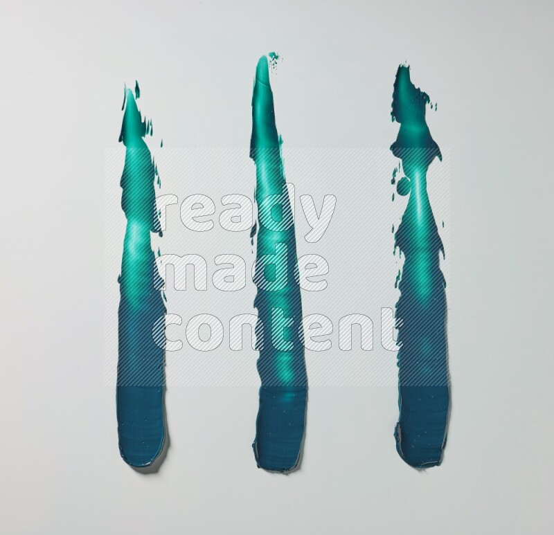 Turquoise painting knife strokes on white background