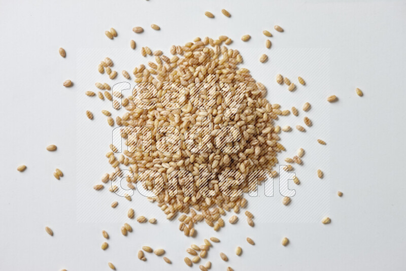 Hulled wheat on white background