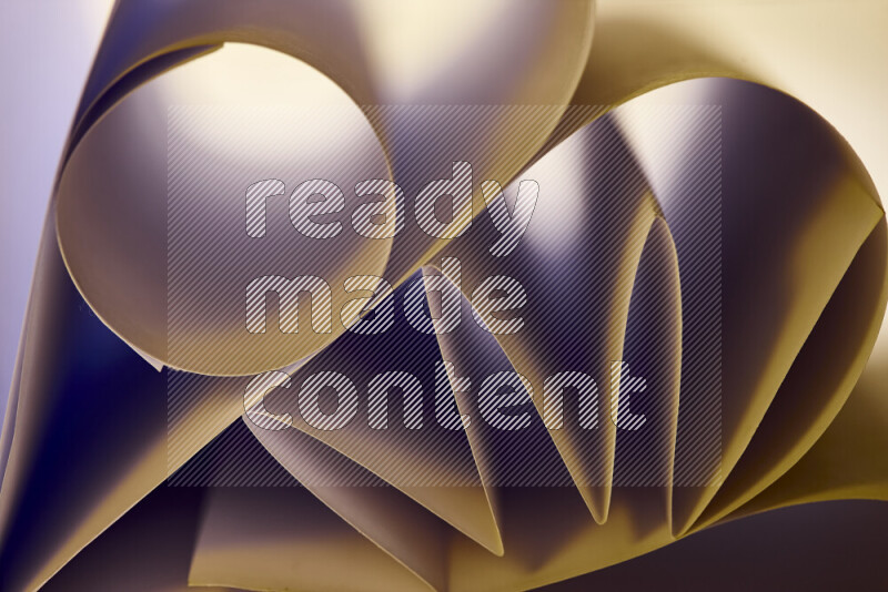 An artistic display of paper folds creating a harmonious blend of geometric shapes, highlighted by soft lighting in warm tones