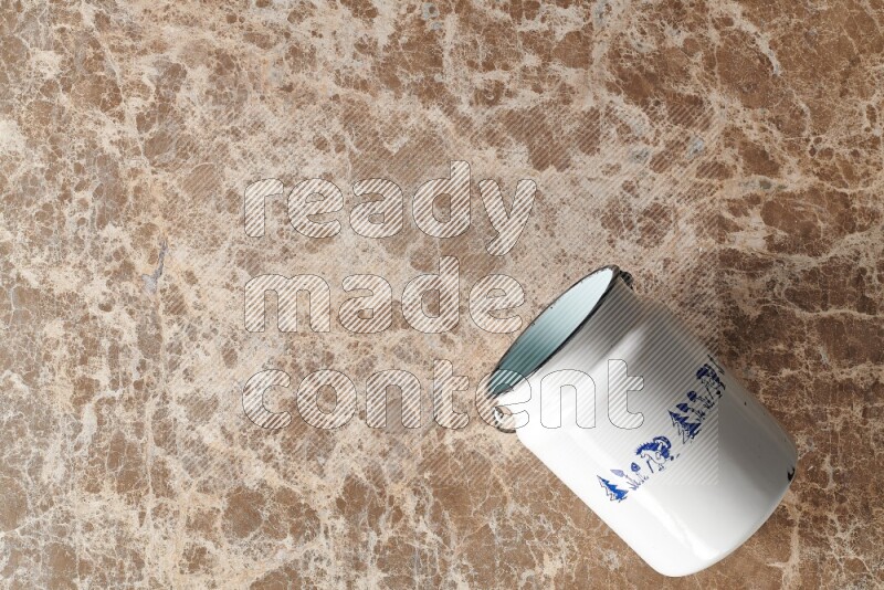A vintage milk can on beige marble background