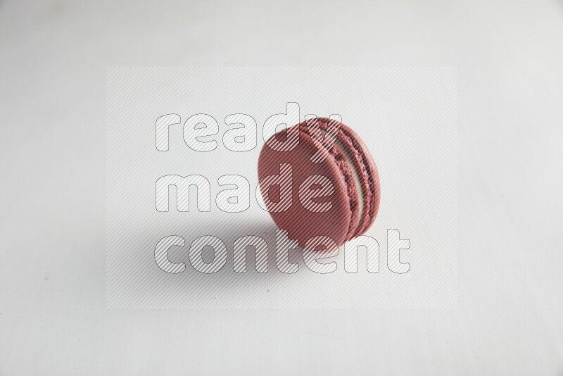 45º Shot of Red Velvet macaron on white background