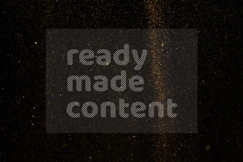 Gold glitter powder isolated on black background