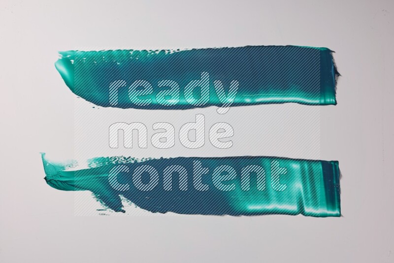 Turquoise painting knife strokes on white background