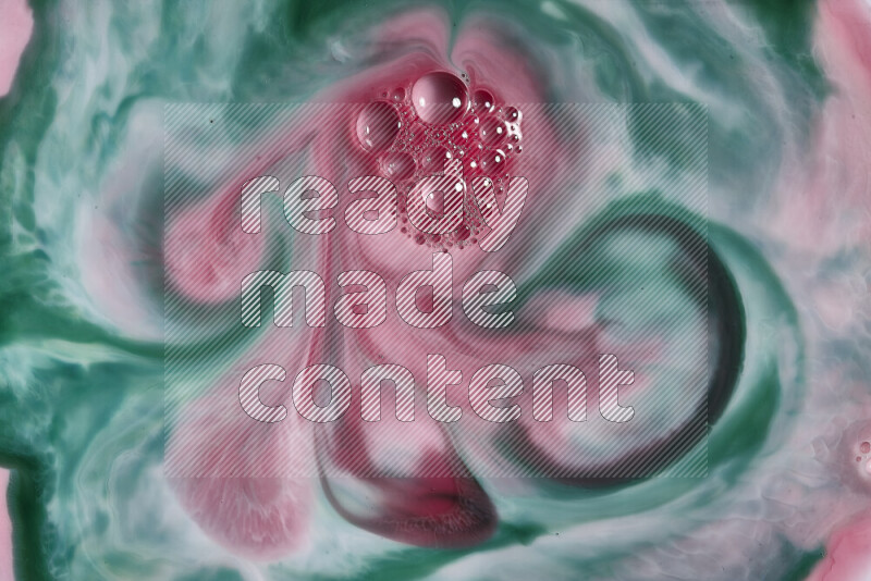 A close-up of abstract swirling patterns in red and green