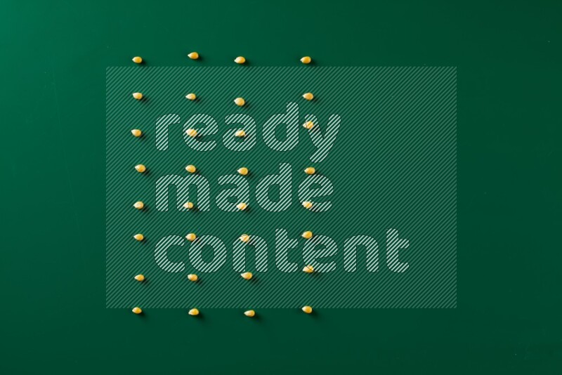 Popcorn seeds on a green background in a top view shot