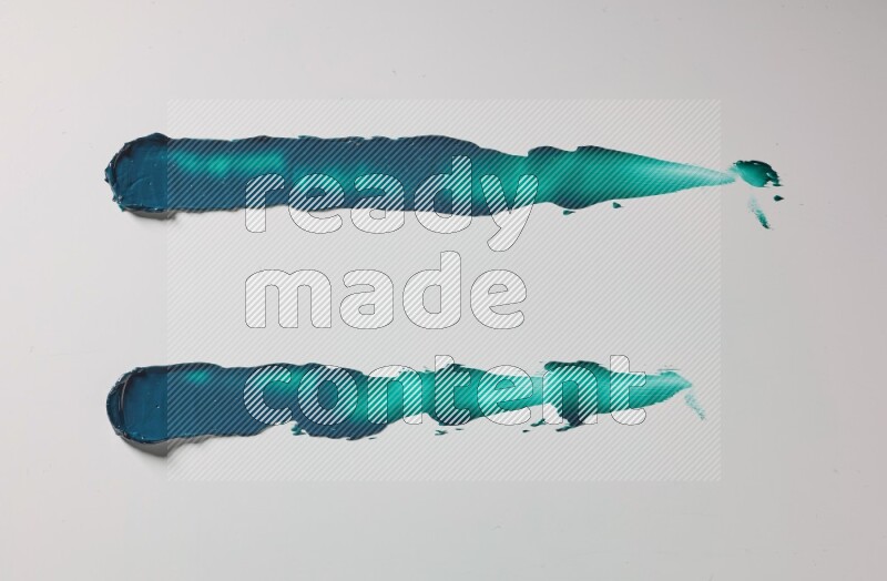 Turquoise painting knife strokes on white background