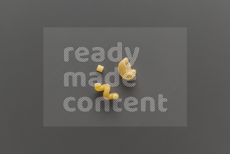 Different pasta types on grey background