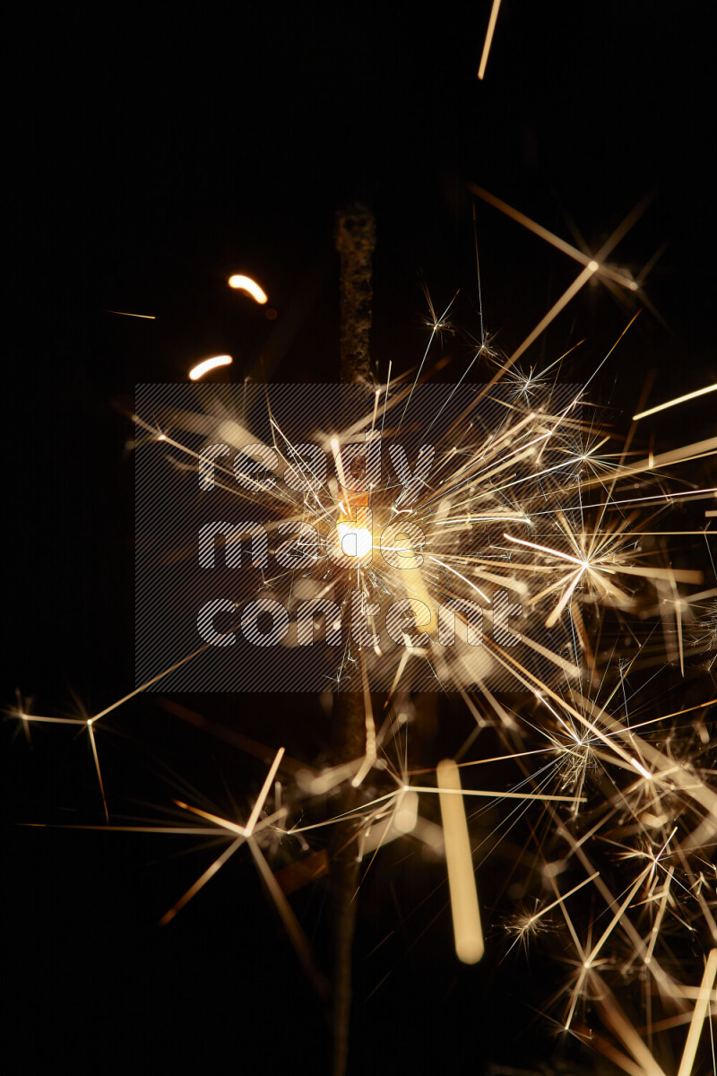 A close-up image of sparkler candle isolated on black background