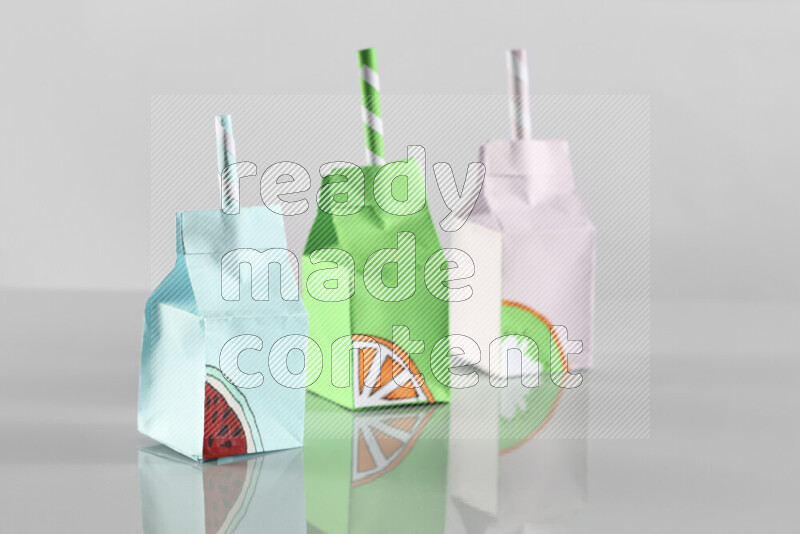 Origami juice box on grey background