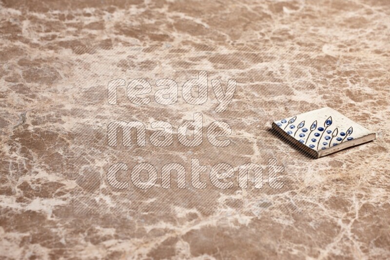 A decorative coaster on beige marble background