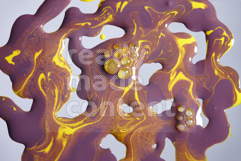 Abstract colorful background with mixed of purple and yellow paint colors